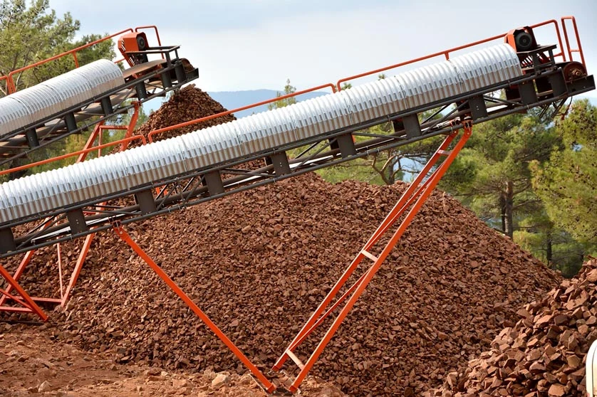 Conveyors and stockpiled material